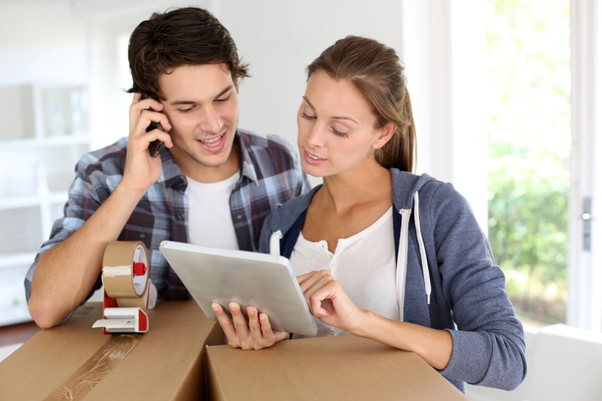 Couple calling transport company to move in new house