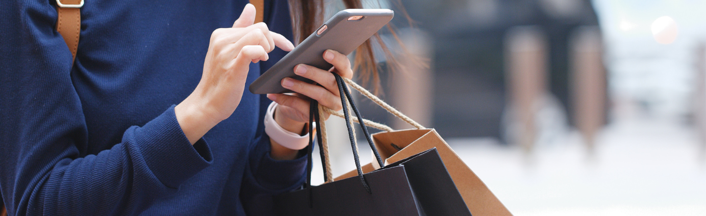 A lady holding shopping bags
