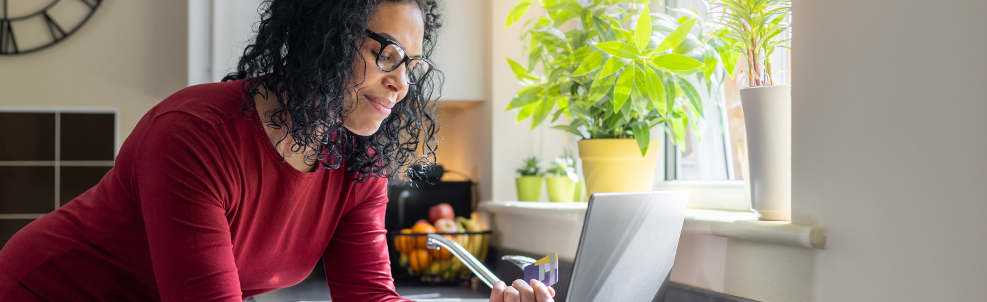 Woman looking at credit card