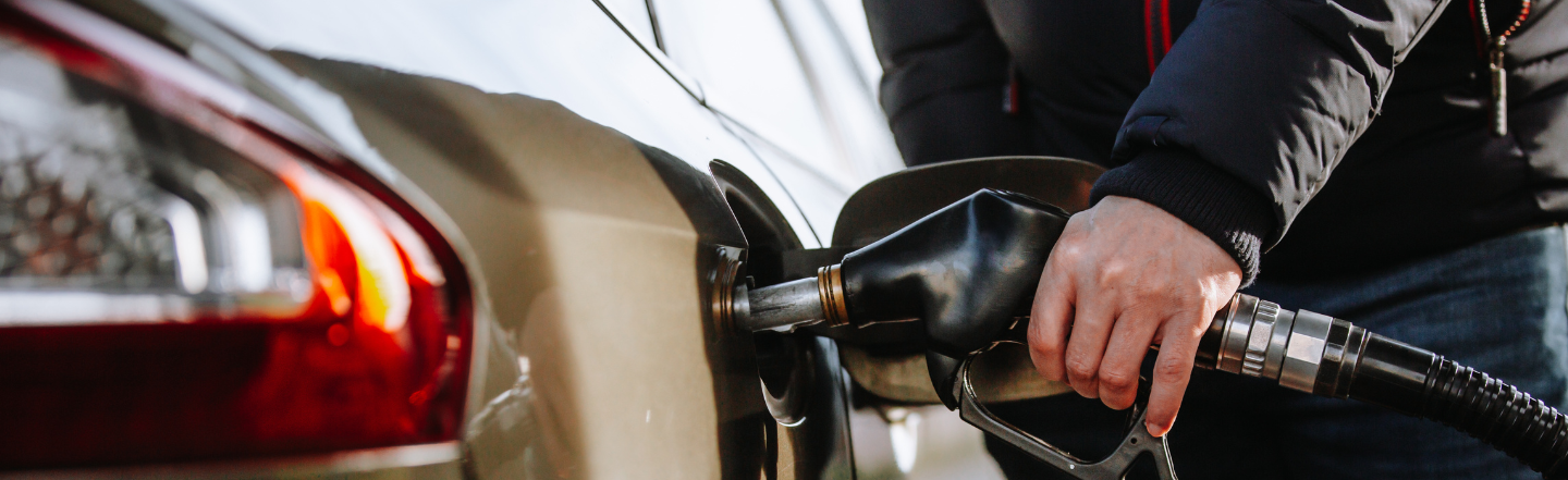 Man filling up car at petrol station