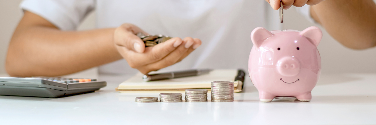 Person adding coins to a piggy bank as savings grow like a pay rise.