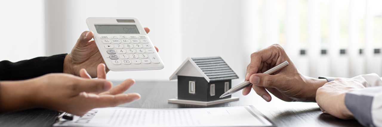 Couple discussing costs of renting vs. buying a home.