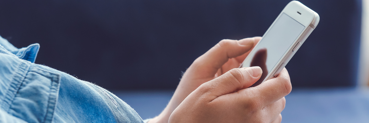 Close-up of someone holding a mobile phone