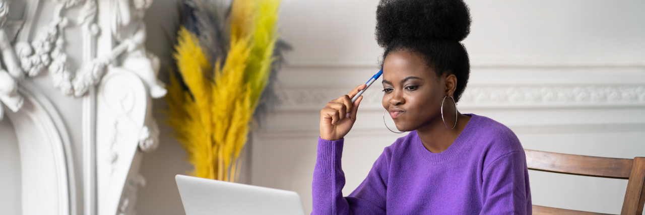 Woman thinking about what she can use a personal loan for.